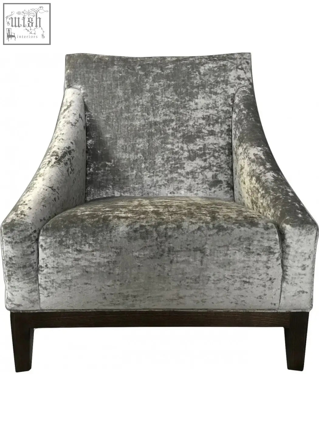 Silver-gray distressed velvet ease arm chair with dark wood legs perfect for cozy living spaces