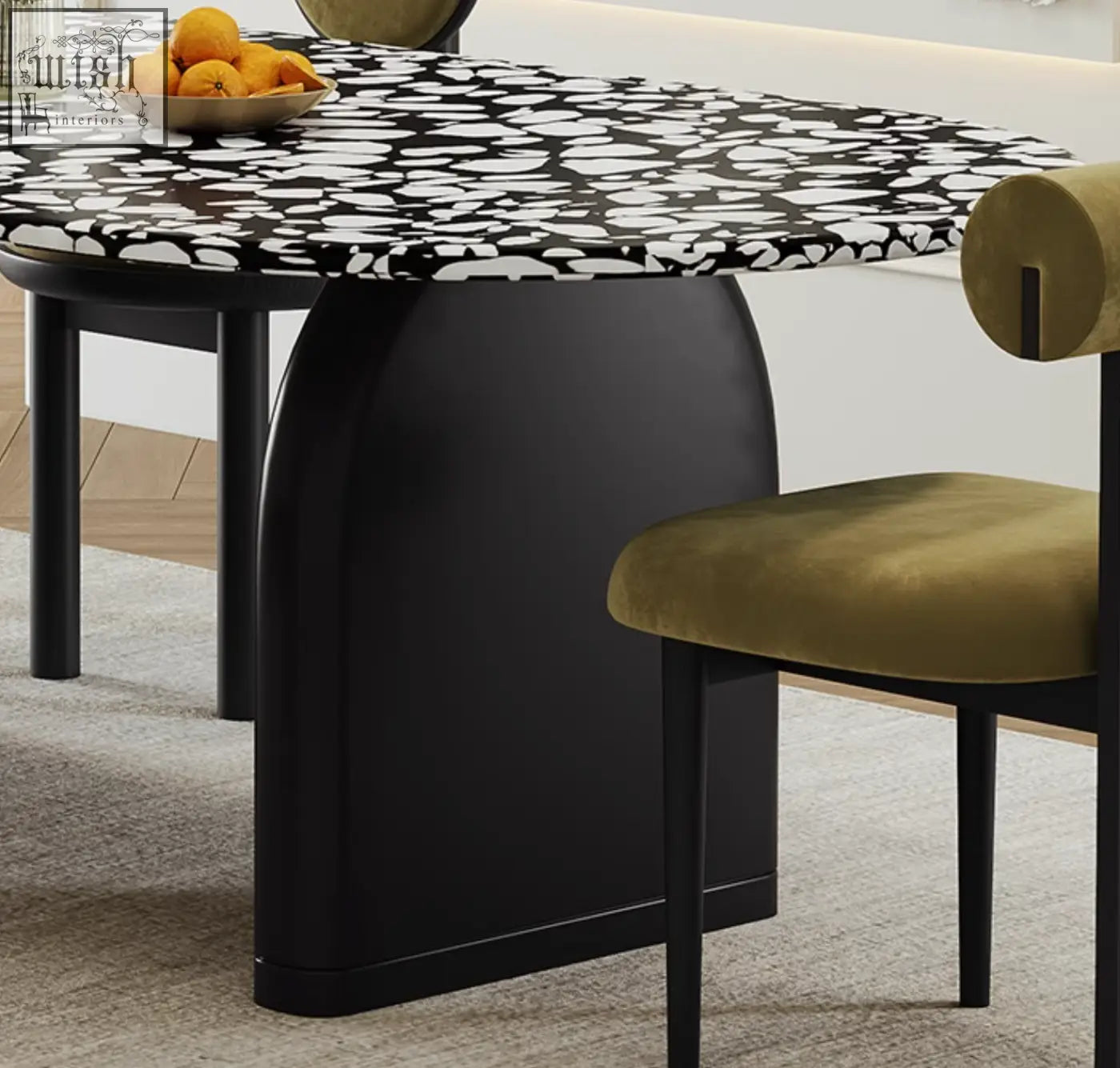 Black eaton dining table with bold black and white abstract stone patterned terrazzo top and sleek curved legs