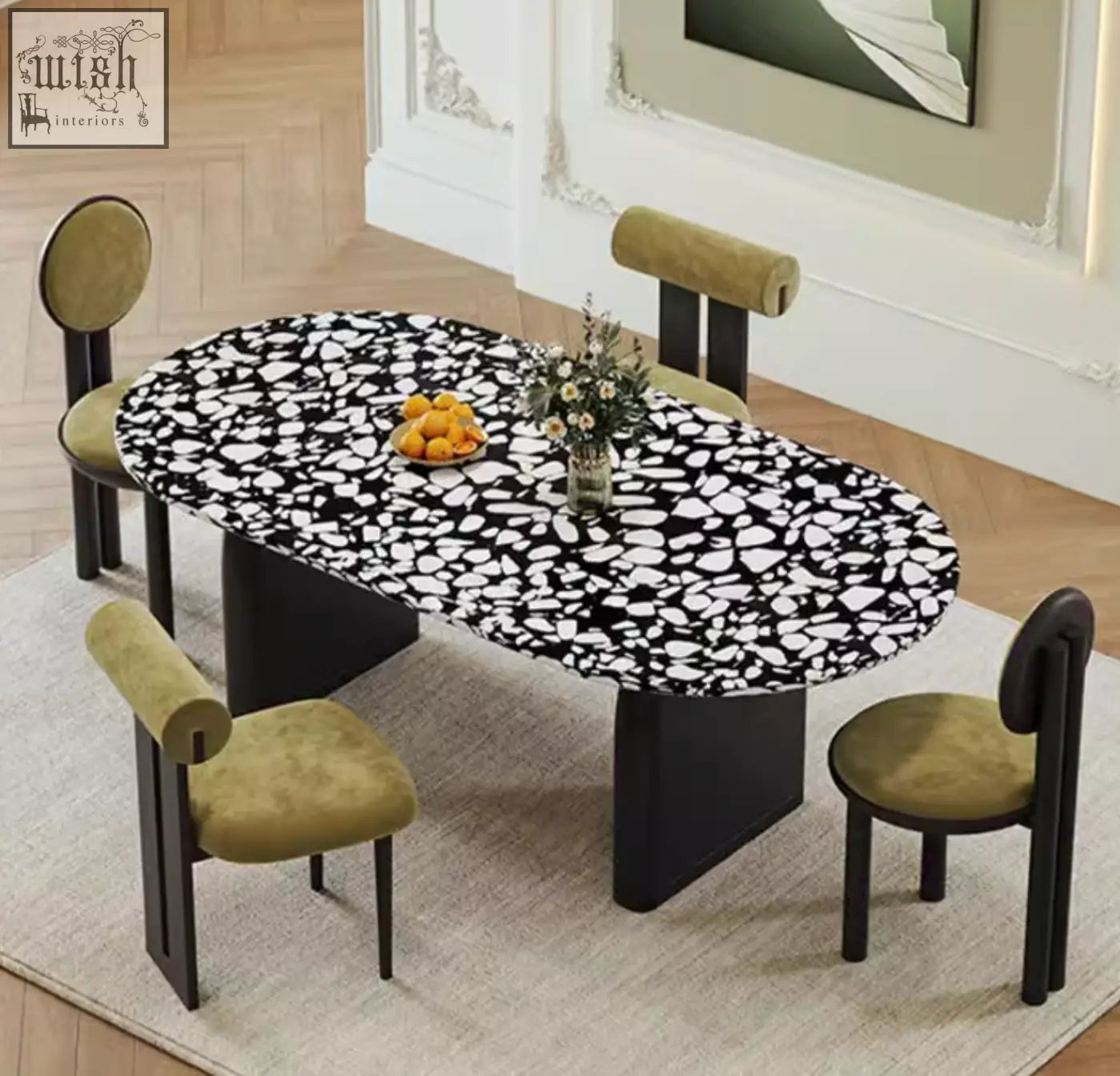 Eaton black dining table with black terrazzo speckled oval top and sleek black pedestal legs perfect for dining rooms