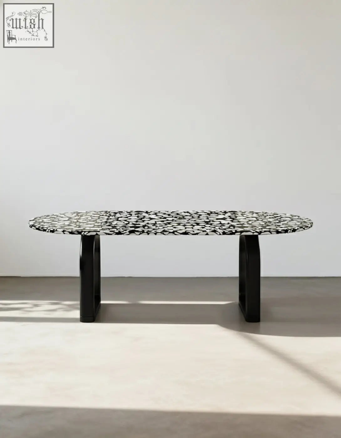 Black dining table eaton dining table with black terrazzo speckled oval top and sleek modern legs
