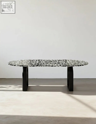 Black dining table eaton dining table with black terrazzo speckled oval top and sleek modern legs