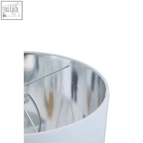 Eben marble base table lamp with ivory shade featuring white cylindrical shade and reflective silver interior