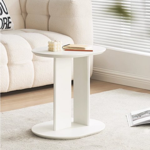 White oval ebony side table with sleek minimalist design and smooth matte finish perfect for small spaces