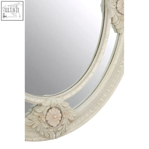 Eclipse antique white ornate oval wall mirror with distressed white frame and intricate floral carvings