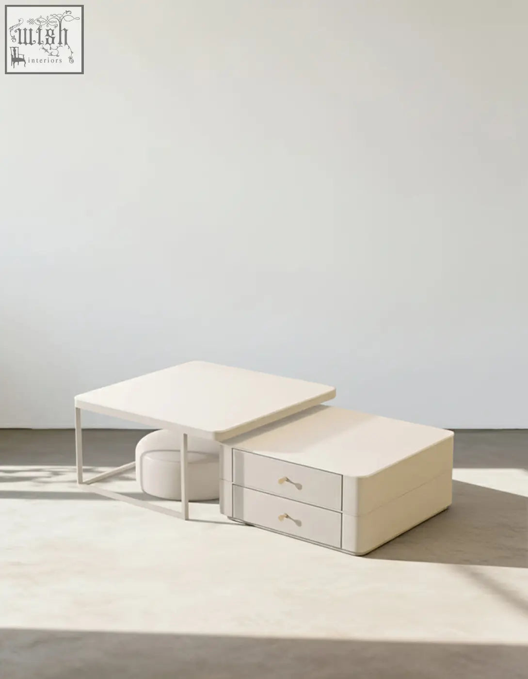 Minimalist cream eclipse nesting coffee table with sleek metal legs and gold handle drawers for stylish living rooms