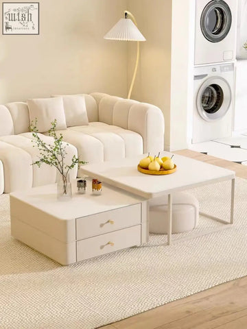 Cream-colored eclipse nesting coffee table with sleek minimalist design and gold-toned drawer handles