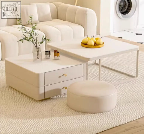 Cream-colored eclipse nesting coffee table with two drawers and minimalist metal legs in a modern nesting coffee table set
