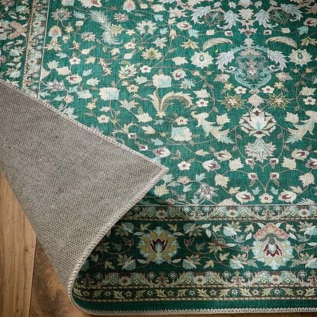 Eco-washable green rug with soft chenille, non-slip tpr backing featuring intricate floral and paisley medallion design