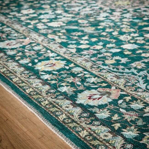 Teal eco-washable green rug with soft chenille medallion design and non-slip tpr backing featuring floral patterns