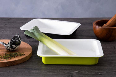 Bright lime green enamel rectangular roasting dish with white interior and rounded corners for baking and roasting