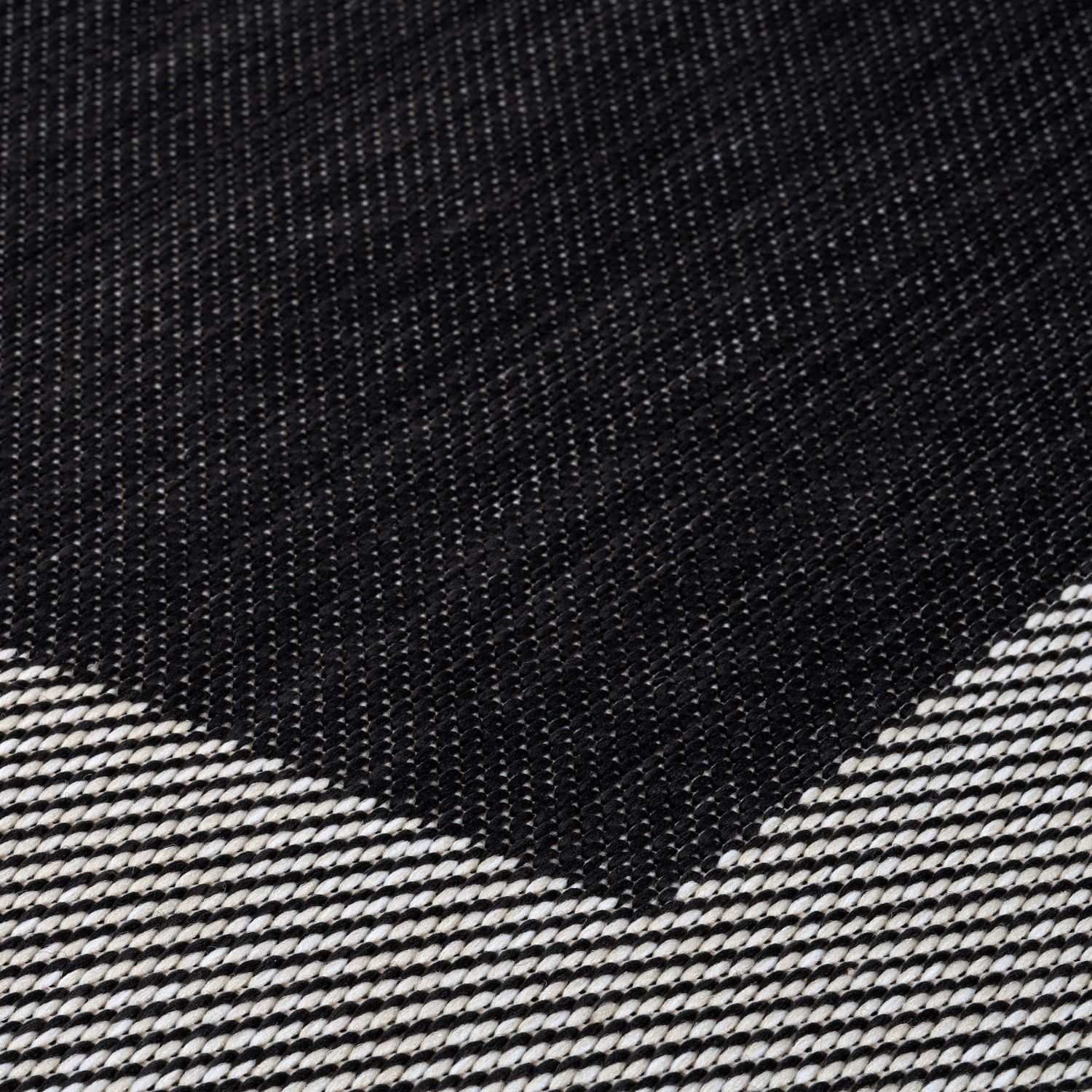 Black and white woven ecology outdoor rug with geometric pattern perfect as an outdoor rug black option