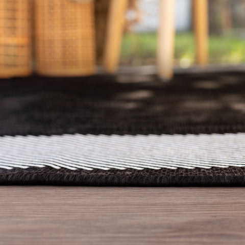 Black and white ecology outdoor rug with textured braided edge perfect for outdoor rug black spaces
