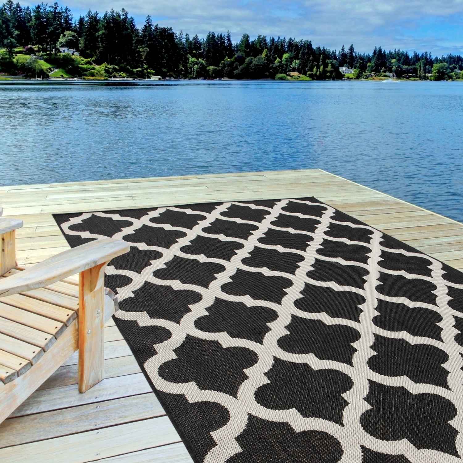 Black and cream geometric patterned ecology outdoor rug black perfect for stylish outdoor spaces