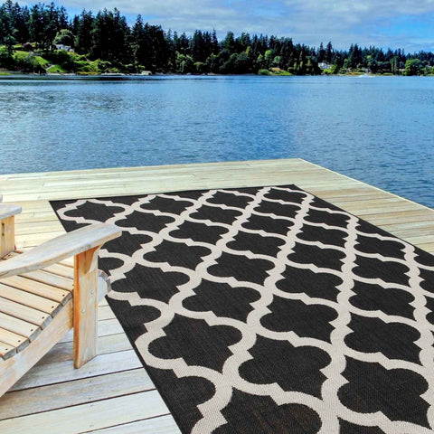 Black and cream geometric patterned ecology outdoor rug black perfect for stylish outdoor spaces