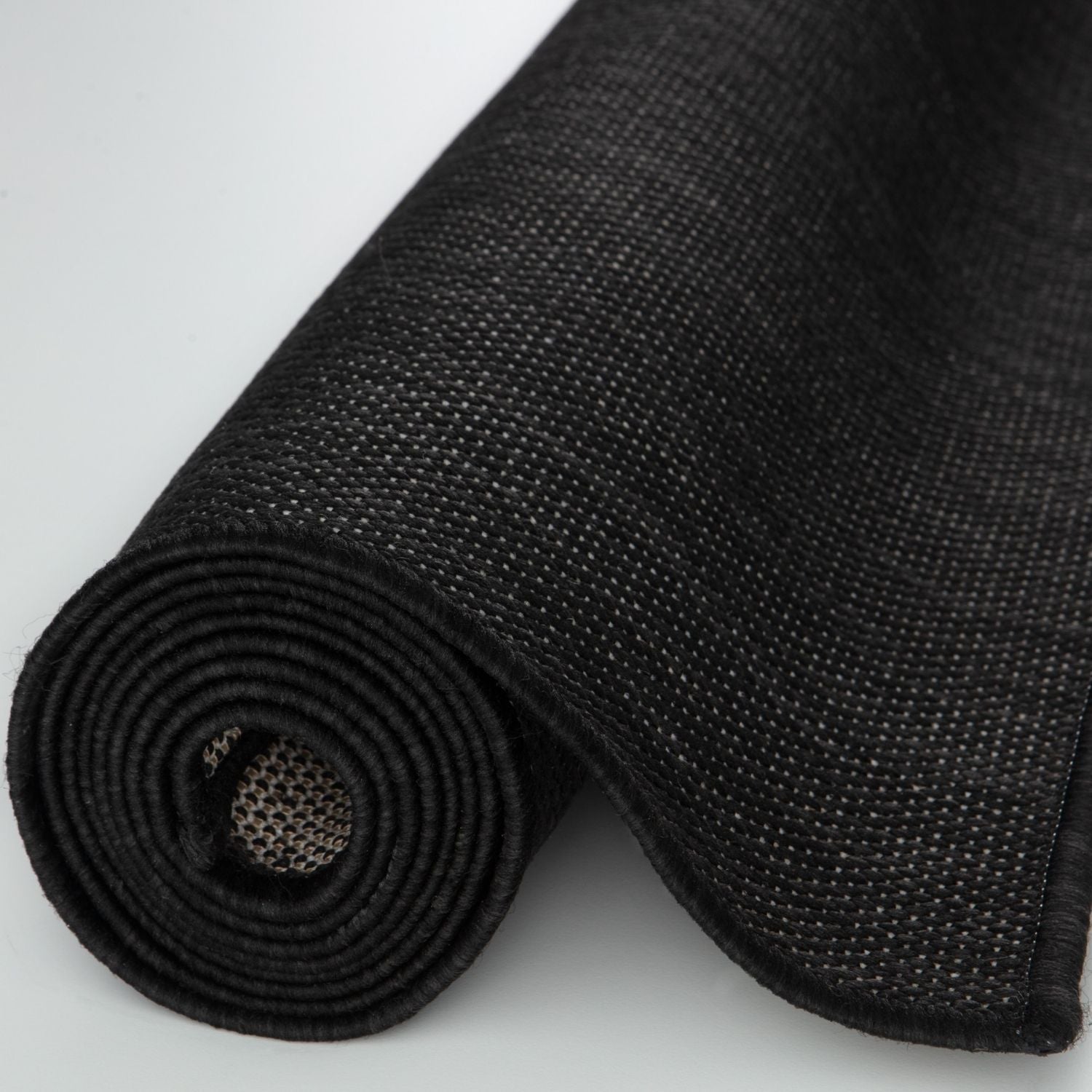 Black textured ecology outdoor rug with woven fabric surface and reinforced edges perfect outdoor rug black option