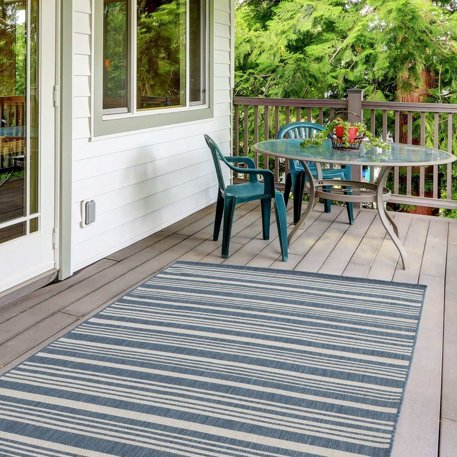 Blue and white striped ecology outdoor rug in outdoor rug blue perfect for patio and garden spaces