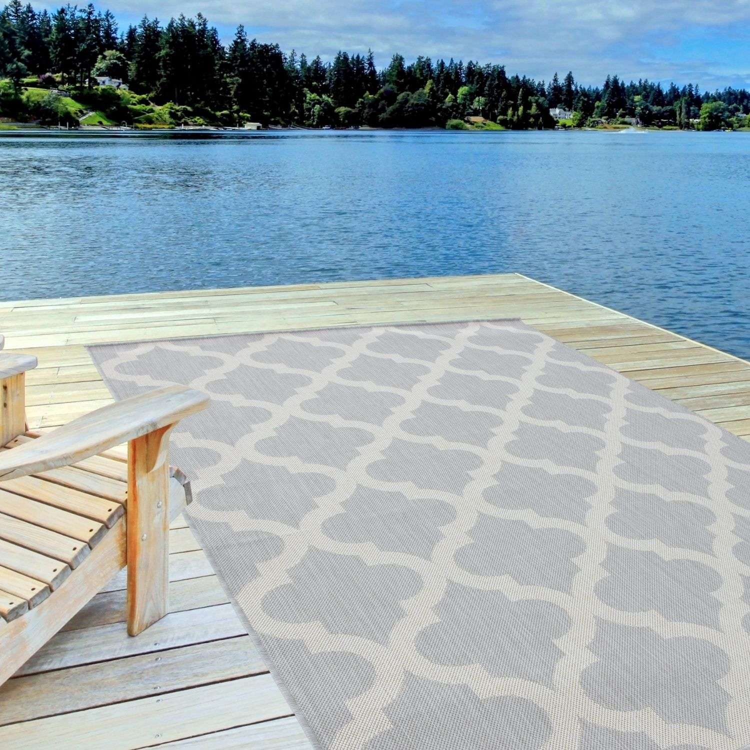 Gray and beige geometric patterned ecology outdoor rug grey 400g on wooden dock perfect for outdoor use