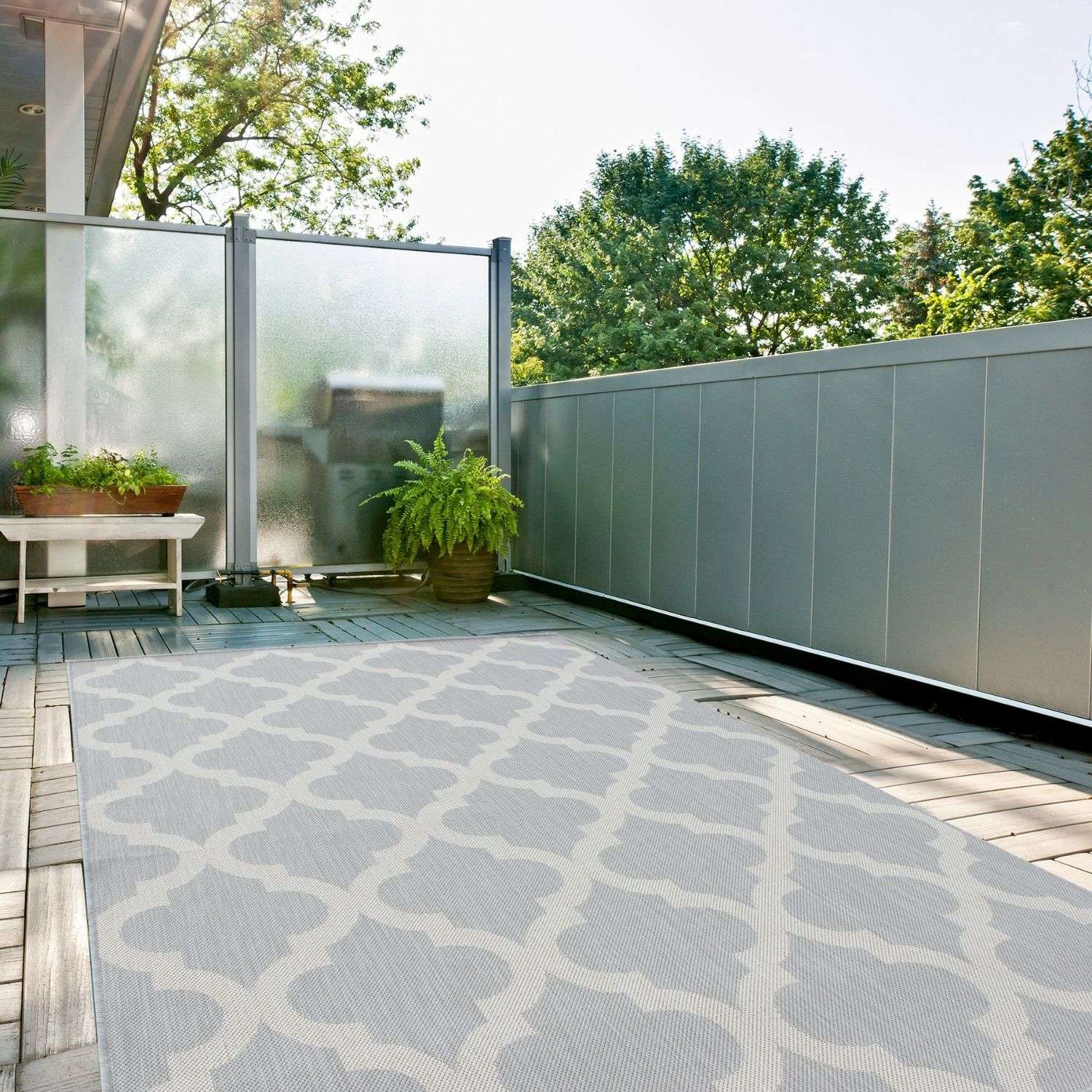 Gray ecology outdoor rug with 400g weight featuring an off-white repeating geometric pattern for outdoor use
