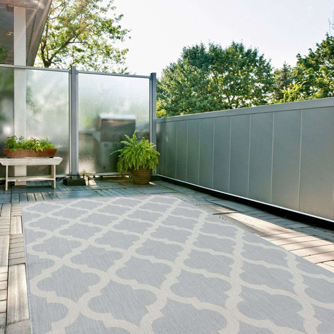 Gray ecology outdoor rug with 400g weight featuring an off-white repeating geometric pattern for outdoor use