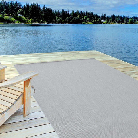 Beige woven ecology outdoor rug grey 500g made for outdoor use on a wooden dock