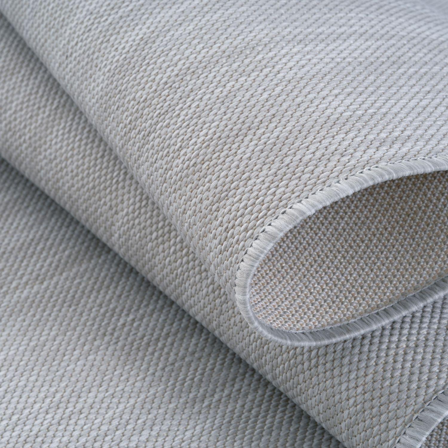 Light gray woven ecology outdoor rug grey with textured tightly interlaced pattern and neatly finished edges