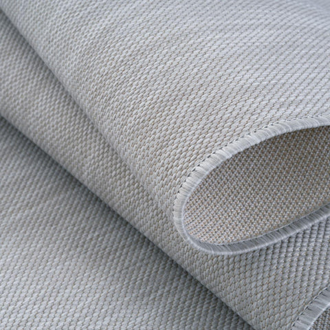 Light gray woven ecology outdoor rug grey with textured tightly interlaced pattern and neatly finished edges