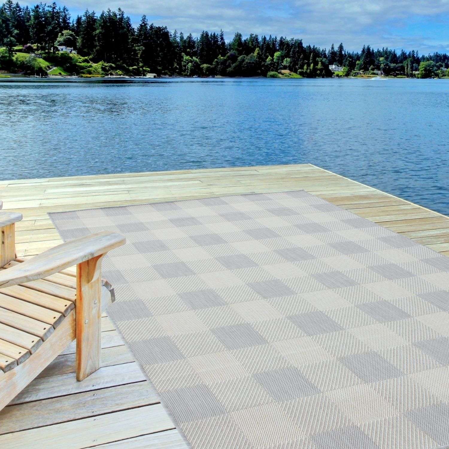 Gray and beige checkered ecology outdoor rug grey with woven texture placed on wooden dock for outdoor use