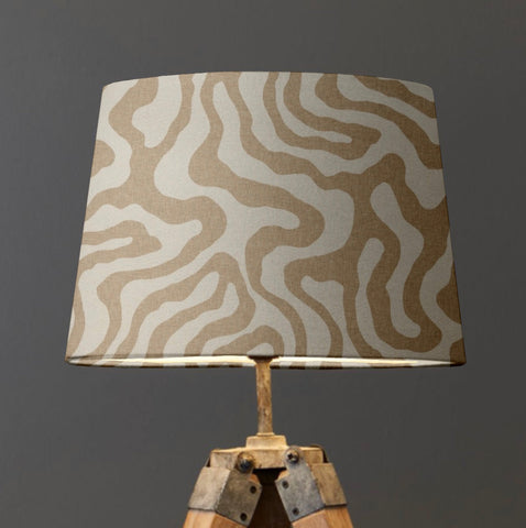 Beige and cream ecru wiggle french drum lampshade with textured fabric on rustic wooden tripod base from wiggle collection