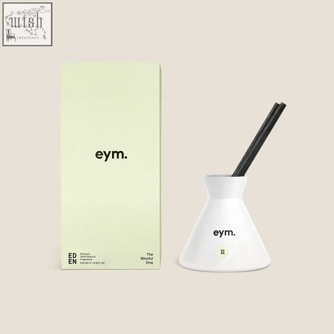 White ceramic diffuser with black reeds and minimalist eden branding perfect for freshening your space