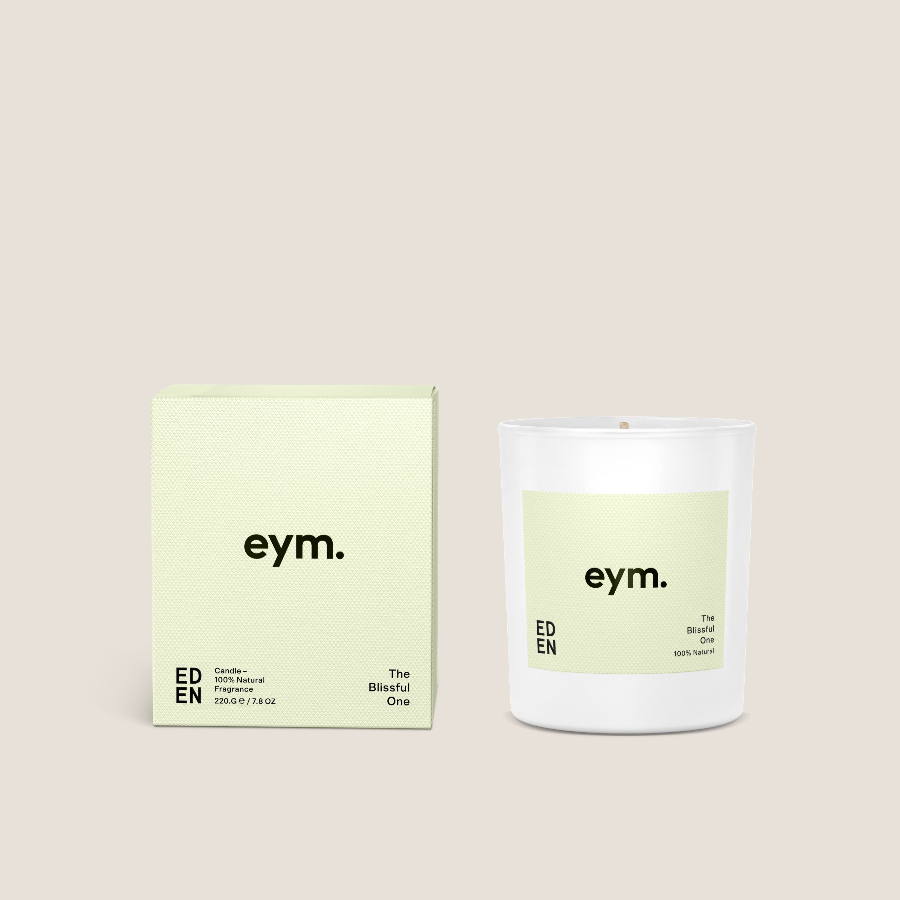 A minimalist white glass standard candle named the blissful one by eym with a pale green label and matching box