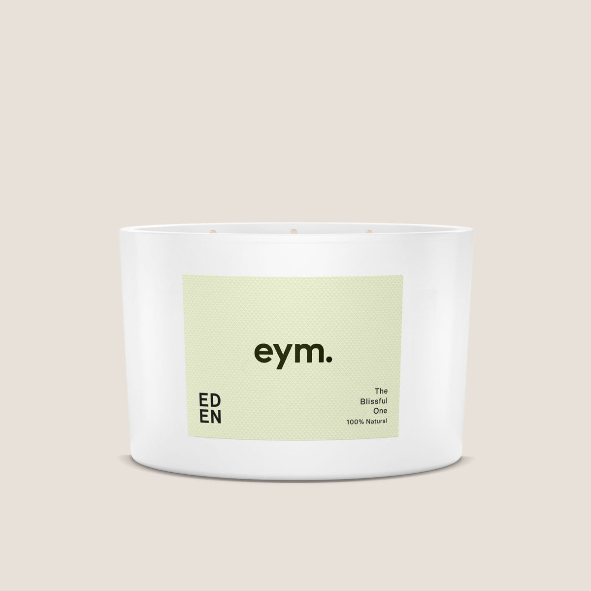 White cylindrical eden three wick candle with pale green eym label the blissful one in black text