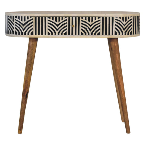 Edessa bone inlay console table features a sleek oval top with black and white geometric pattern and mango wood legs