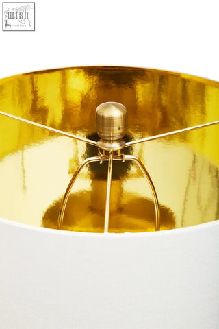 Edgar black marble and gold table lamp with a gold finished lampshade white exterior and brass metal support