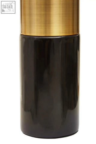 A sleek salt or pepper shaker with a brushed gold top and glossy black body for edgar black marble gold table lamp fans