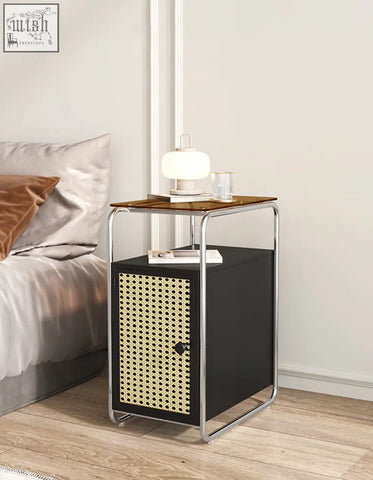 Black edison clear acrylic side table with woven cane front panel, chrome frame, and wooden top surface
