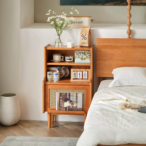 Light brown solid wood edith bedside table with cane weave panel and open shelving for bedroom storage