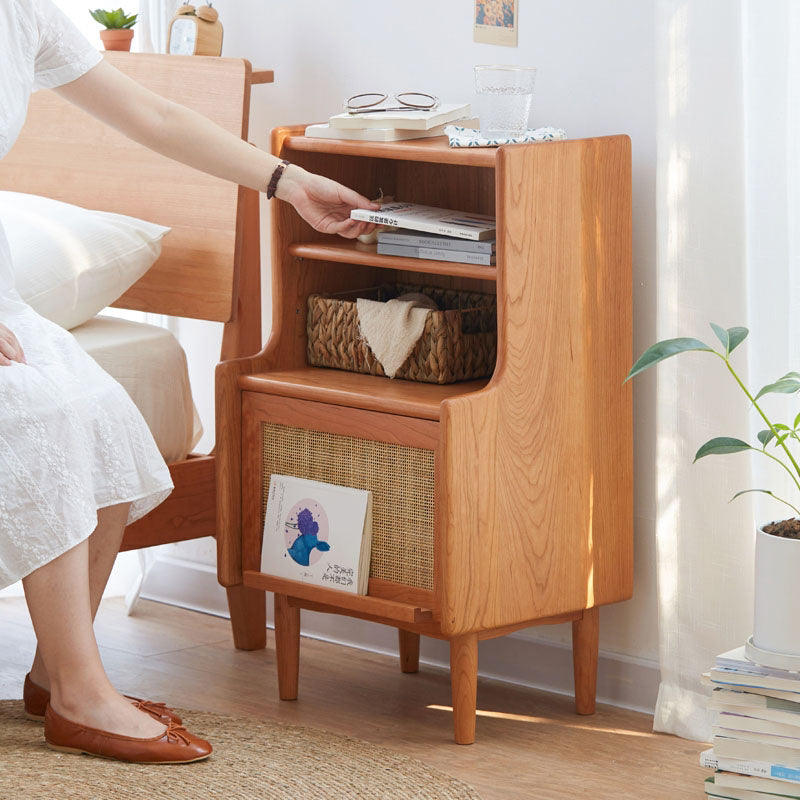 Light brown solid wood edith bedside table with woven cane panel and open shelves for bedroom use