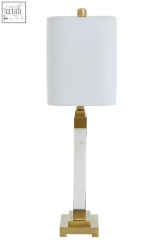 A sleek edith table lamp with a white rectangular shade, clear acrylic column, gold accents, and white marble base