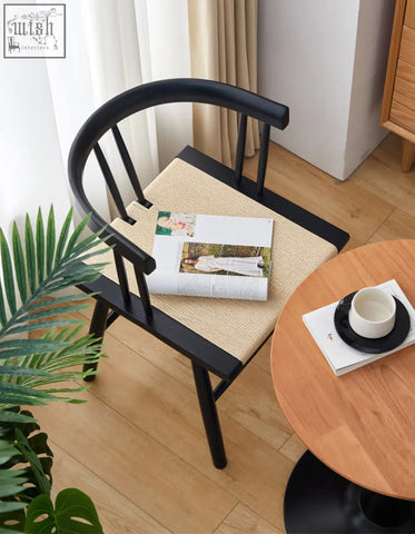 Black wooden eenoch dining chair with woven beige rattan seat cushion for stylish dining use