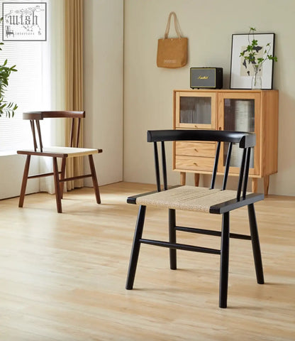Black wooden eenoch dining chair with woven beige rattan seat and curved backrest perfect for dining rooms