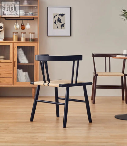 Black wooden eenoch dining chair with woven natural rattan seat perfect for stylish dining spaces
