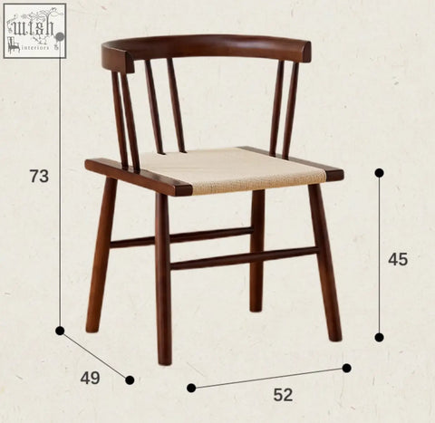 A dark wood eenoch dining chair with a woven beige rattan seat and vertical spindles perfect for dining rooms