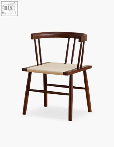 Dark wood eenoch dining chair with woven beige rattan seat and curved backrest for stylish dining use