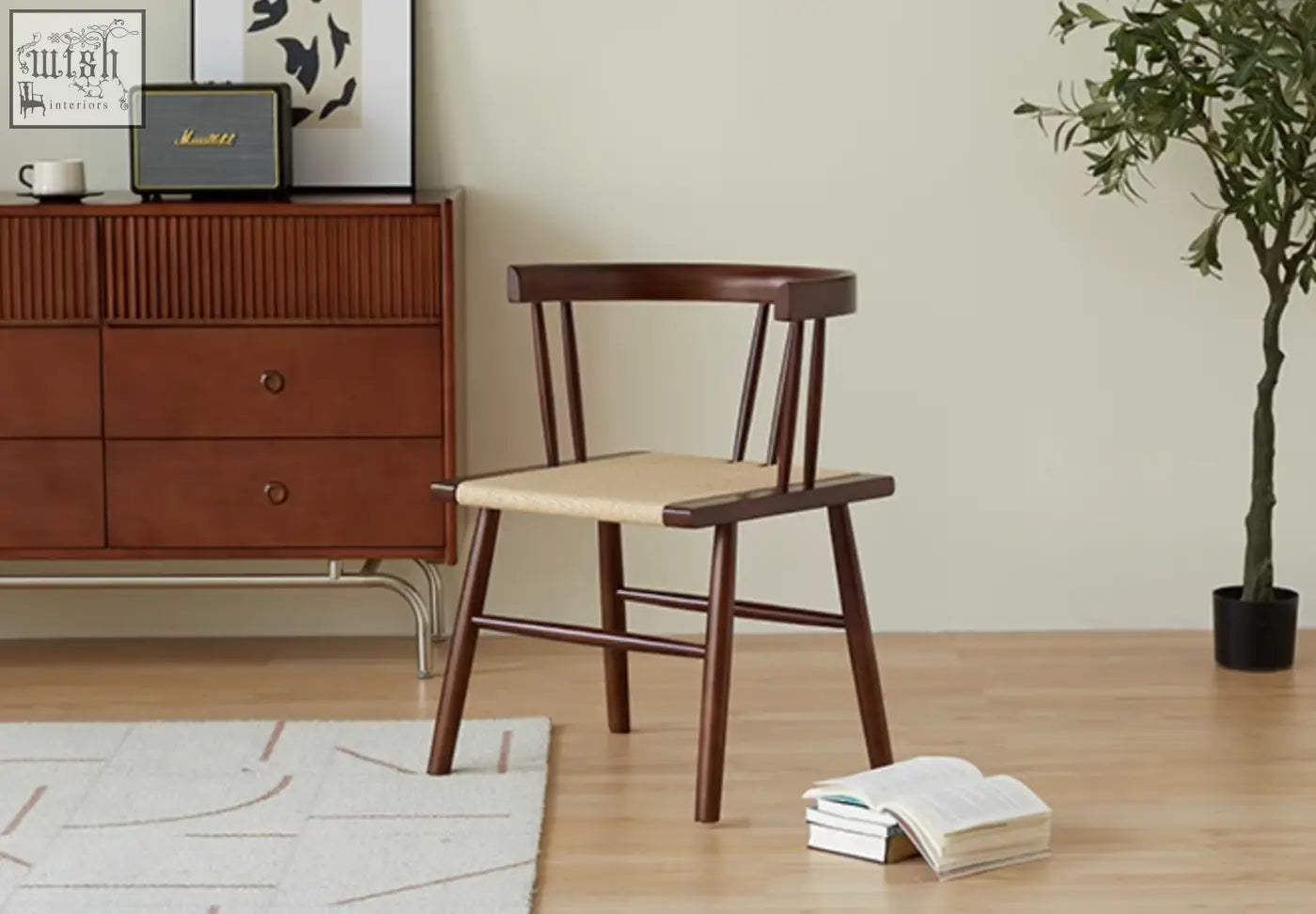 A dark wood eenoch dining chair with a woven beige rattan seat and curved backrest for stylish dining use