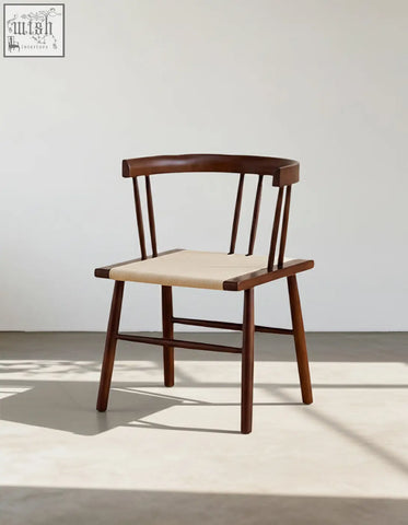 Minimalist eenoch dining chair with curved wooden backrest and woven beige rattan seat perfect for dining areas