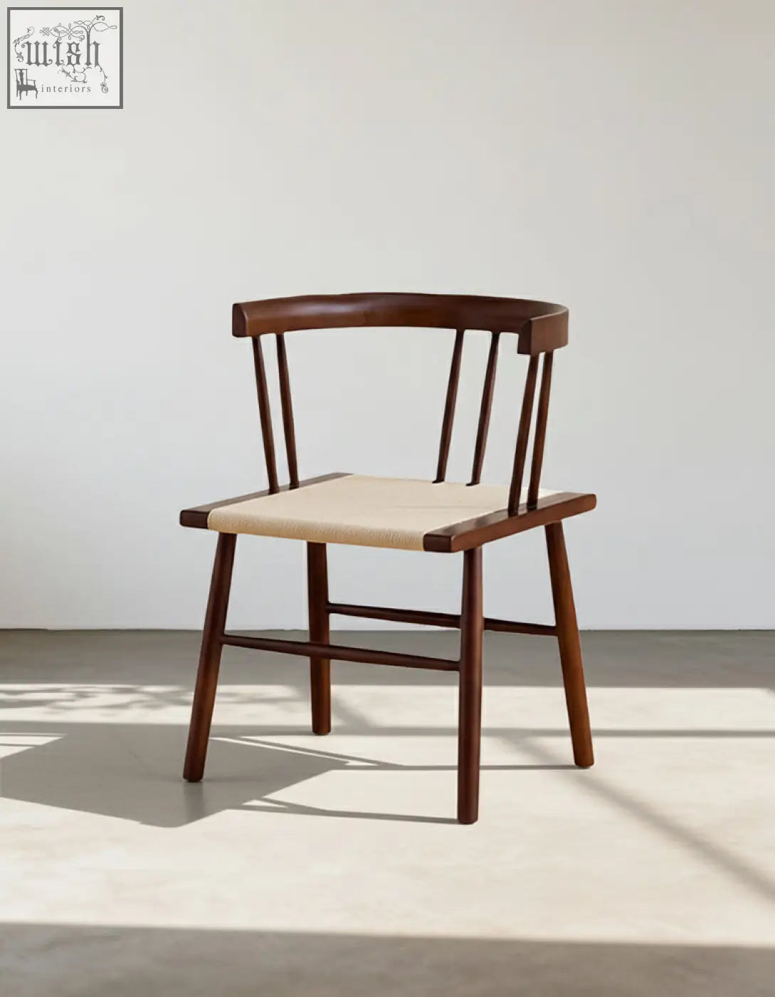 Minimalist eenoch dining chair with curved wooden backrest and woven beige rattan seat perfect for dining areas