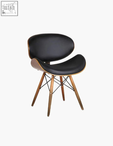 Black leather upholstered eiffel dining chair with curved walnut frame and tapered legs easy to clean with damp cloth