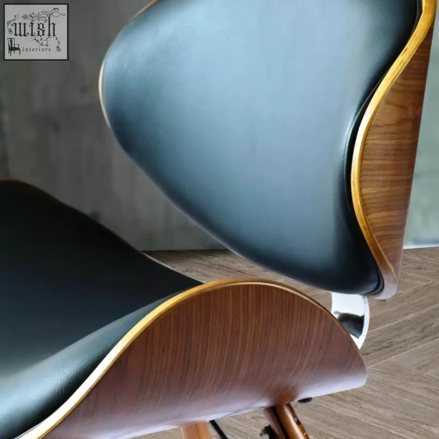Black leather and walnut wood eiffel dining chair with curved mid-century modern design for dining use