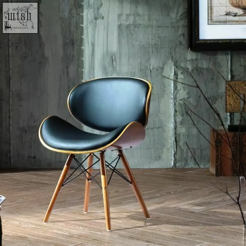 Eiffel dining chair in walnut with black leather upholstery gold trim and slender wooden legs clean with damp cloth