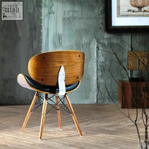 Eiffel dining chair with curved walnut wooden back black upholstered seat and slender light wood legs
